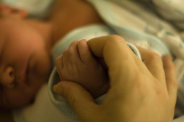 image of baby holding hand