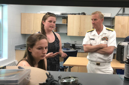 RADM John P. Neagley '82 talks to UNH students.