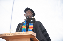 UNH College of Liberal Arts Associate Dean Reginald Wilburn singing "America the Beautiful" during commencement 2018