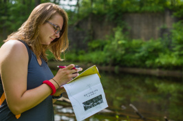 Riley Boss '19 using map to document building locations.