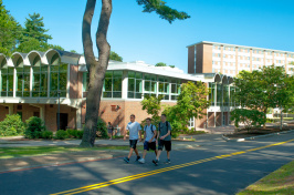 Students walking by Stillings Hall at UNH 