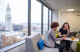 Students working in an office in the city