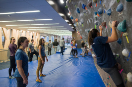 UNH students at the campus bouldering wall