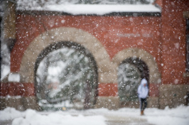 A view of the arch of UNH's T Hall in winter