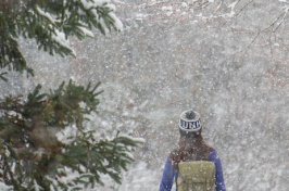 student walking in the snow