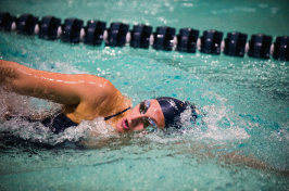 A UNH swimmer in the pool at the 2018 America East Championship