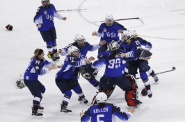 US women's hockey team celebrating winning gold at the Olympics