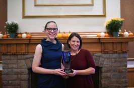 Alley Leach and Jenn Andrews from UNH Sustainability Institute hold their UNH Innovator of the Year trophy