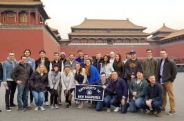 Students pose in front of forbidden city in China
