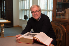 photo of Douglas Lanier with Shakespeare Folio