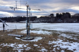 TOWER WITH AUTOMATED SENSORS AT KINGMAN FARM HAYFIELD IN WINTER. 