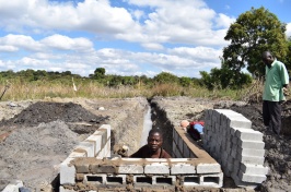 Trench leading from a spring to the wall where villagers can get water