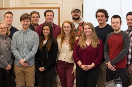 UNH students pose in classroom