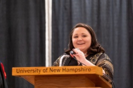 Woman speaking on a stage