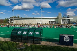 Members of the NH Legislature sitting outside on Memorial Field 