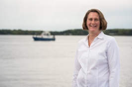 Portrait of marine researcher Jennifer Miksis-Olds with ocean in background