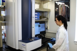 UNH student employee uses the MALDI-TOF instrument.