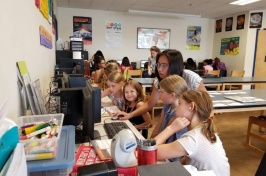 Past Aspirations in Computing Award recipient helps with a girls’ coding program.
