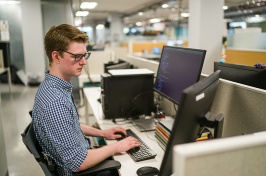 Student at desk in cybersecurity program