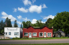 Small rural town with white and red buildings