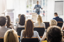 Professor lectures in front of a classroom