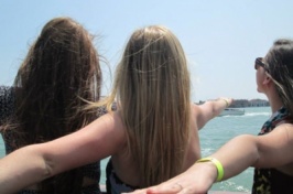 Three girls at a lake