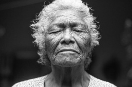 elderly woman with eyes closed