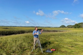 Researcher stands alone in marsh