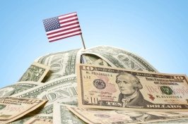 A graphic of an American flag on a pile of money.