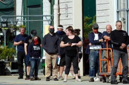 A group of people standing in line