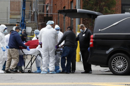 Photo of a body being loaded into a hearse