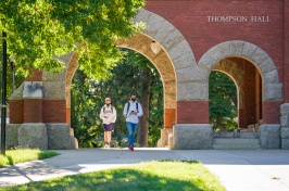 students walking through T Hall arch