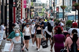 Image of people walking in a busy street 