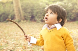 boy outside, looking up in wonder