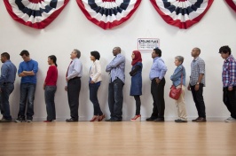 People of different ethnicities lining up to participate in government elections