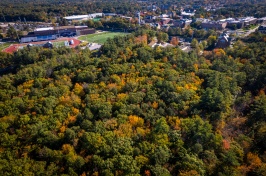 aerial photo of UNH College Woods in fall with football stadium in background