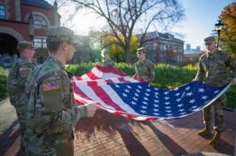 UNH ROTC students holding American flag