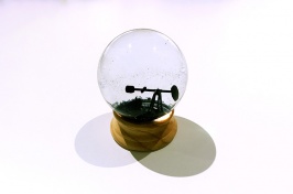 snow globe with oil rig inside