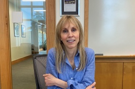 Sherri Cannon sits at a conference table at Paul College.