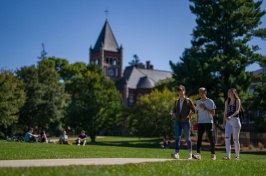 Students walking in front of Thompson Hall in summer