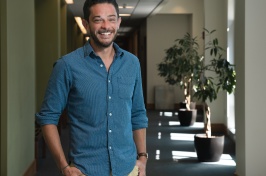 Scott Lemos stands outside his office at Paul College.