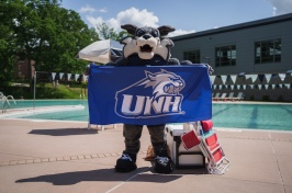 Wild E Cat poses with a towel at the pool