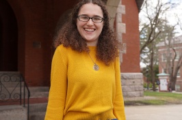 Sarah Nicholls stands outside of Thompson Hall