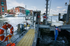 Tidal turbine platform beneath a bridge with Portsmouth in the background