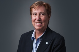 New UNH provost Jeanette Riley poses for a photo in front of a gray background