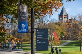 A banner highlighting UNH's STARS Platinum sustainability rating hangs on Main Street across from Thompson Hall