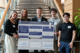Paul College students present their research poster exploring whether paying high rent prices impacts academic success.