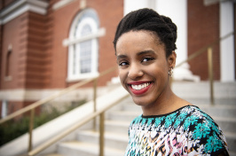 UNH graduating senior Bethany Cooper '18 on the steps of Hamilton Smith Hall
