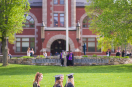 UNH seniors pose for pre-graduation pictures on campus during the week before commencement