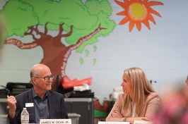 President Dean speaks with the superintendent of Manchester schools